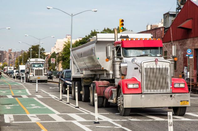 Protected bike lanes are great. But what if they're right next to a bunch of carbon-spewing trucks?